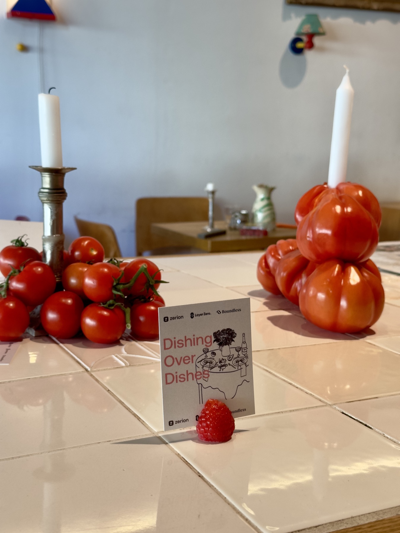 Dishing over Dishes table card with tomatoes and candles