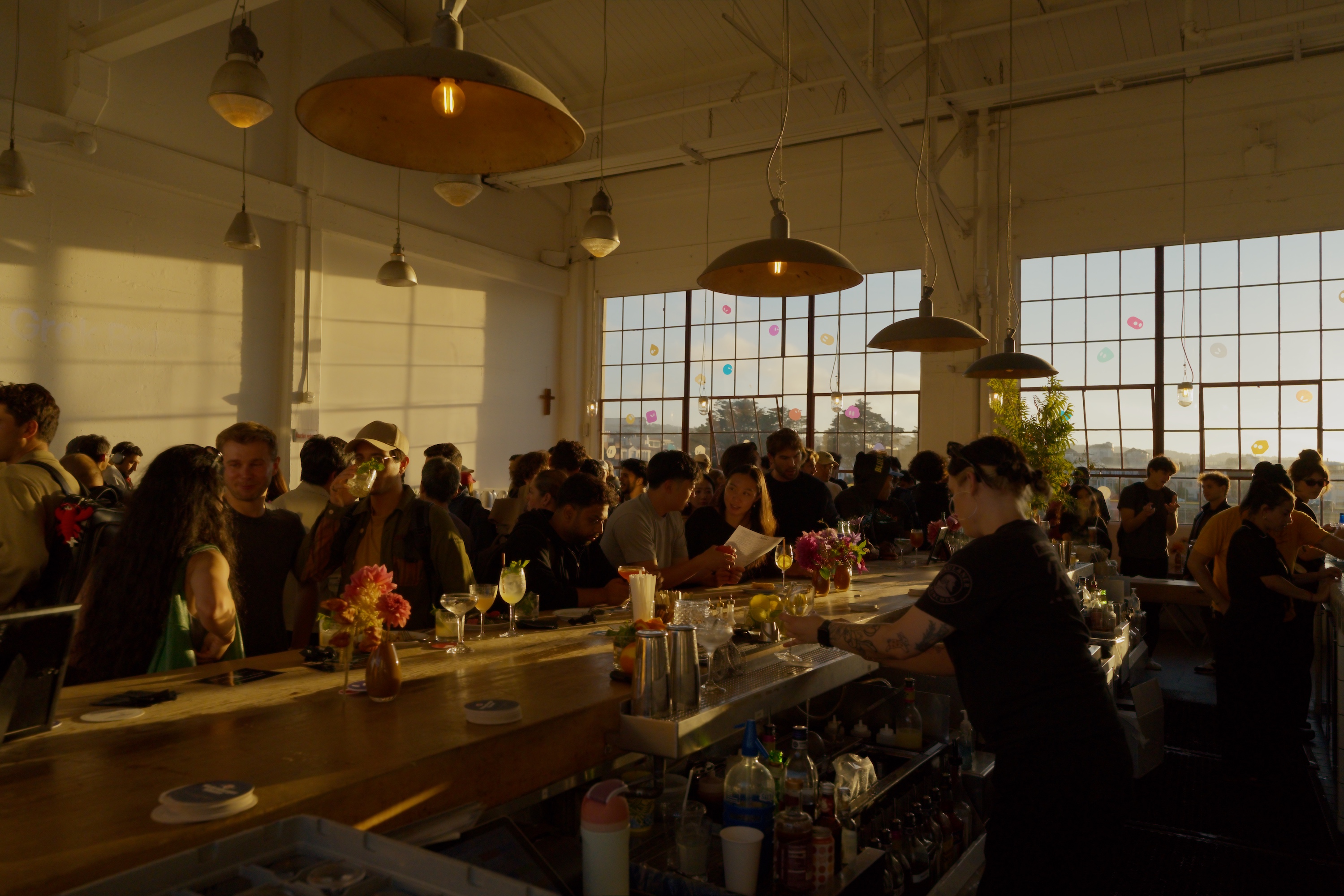 Builders gathered around the bar at Grok Builders Night in San Francisco