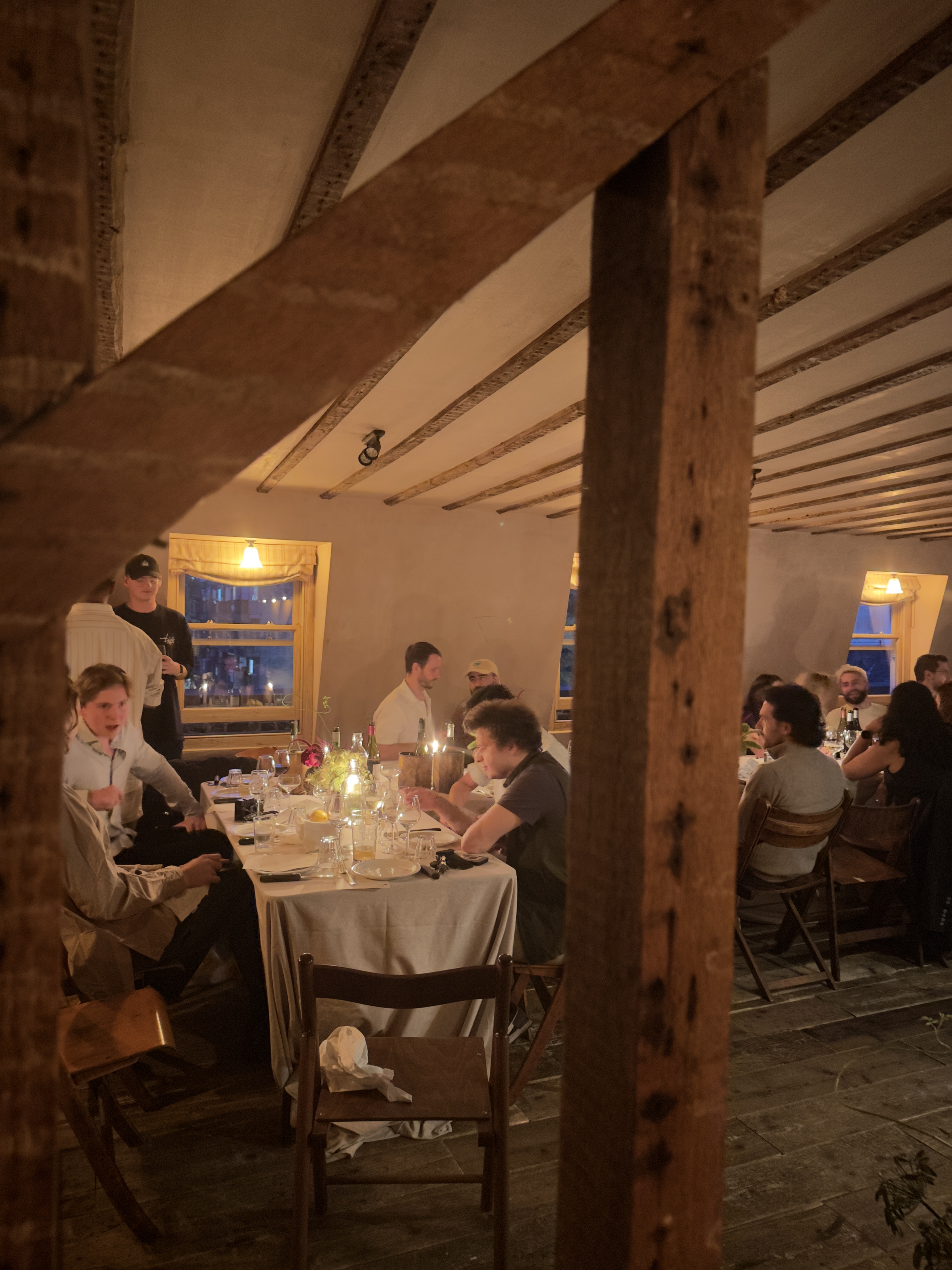 London dinner guests in conversation around the table