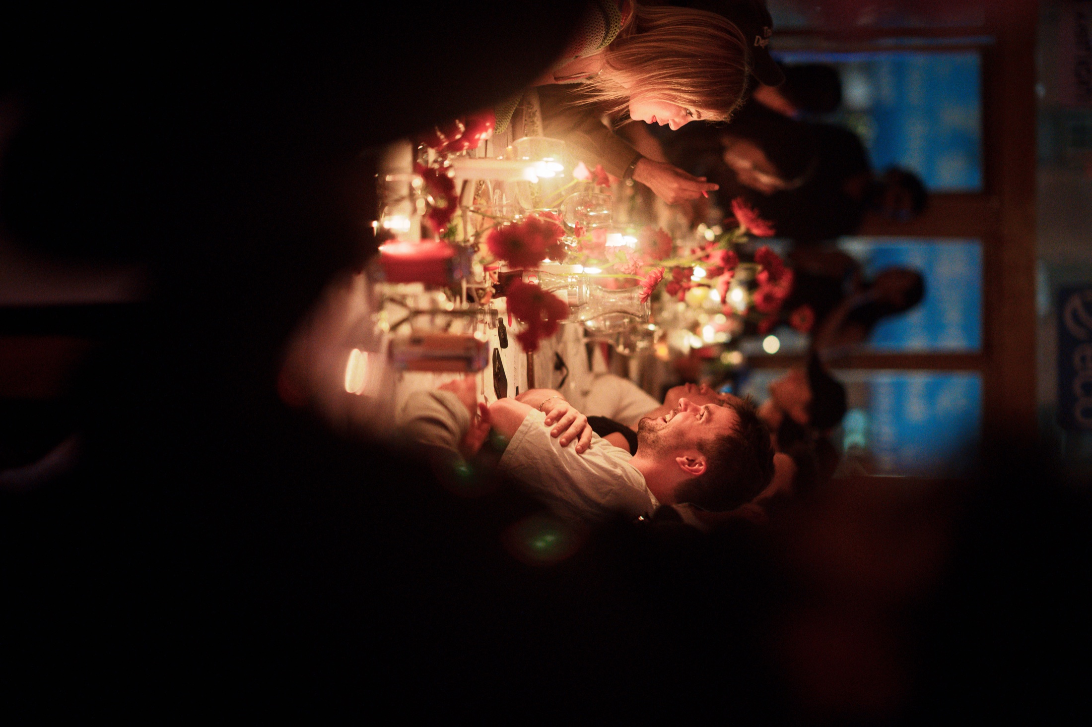 Guests talking across a candlelit table at Zerion Supper Club NYC